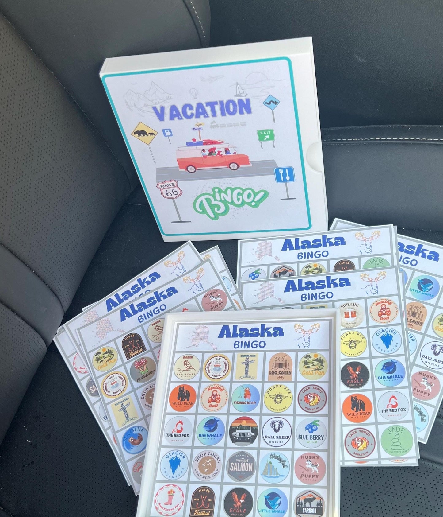 Vacation Bingo Travel Game Alaska edition with hard sided case and 12 unique game cards. Great Summer Family Vacation for Adults and Kids.